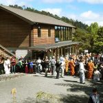 Under a clear and sunny sky the sangha goes pindapat.