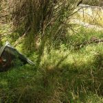 Off to one side of the river there is shade and relatively flat ground for camping.