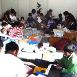 The kids dhamma class busy making pages for their work book. The dhamma wheel was the theme for this day.