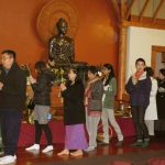 Part of the circumambulation leaving the sala to walk around the Buddha three times - Buddha Dhamma Sangha.