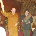 Ajahn Tiradhammo joyfully sprinkling holy water over the assembled crowd of monastery supporters. Sadhu sadhu sadhu.