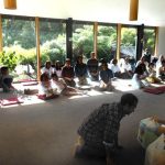 Children and parents from the Tawa dhamma school join for the meal offering.