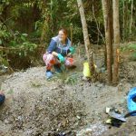 Christine and Angie working on planting the bare earth edges of the the new sala by-pass road.
