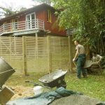 Cameron and Stefan concreting in the posts for the new garden kuti privacy screen.