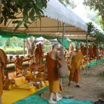 Monks preparing for the meal as part of the celebrations over several days at Wat PahAmpawan in Chonburi Thailand.
