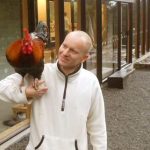 Anagarika Colin having a hearty precepts discussion with that rooster.