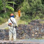 Paul cleaning around the stupa.