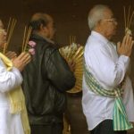 Venerable Elders circumambulating the main shrine hall.