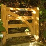 A dappled wooden gate.